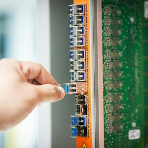 Engineer fixing core swith in data center room