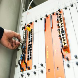 Engineer fixing core swith in data center room