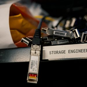 Low angle of various connectors and USB cables placed on shelf with storage engineer inscription